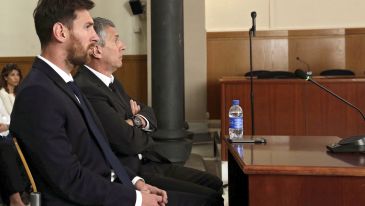 Leo Messi (L) i jego ojciec Jorge